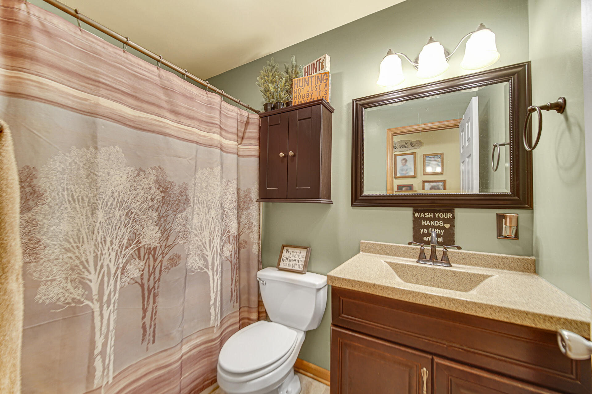 505 North Washington Street Hebron, IN 46341 - Photo 15 of 27 a bathroom with a toilet a sink and mirror