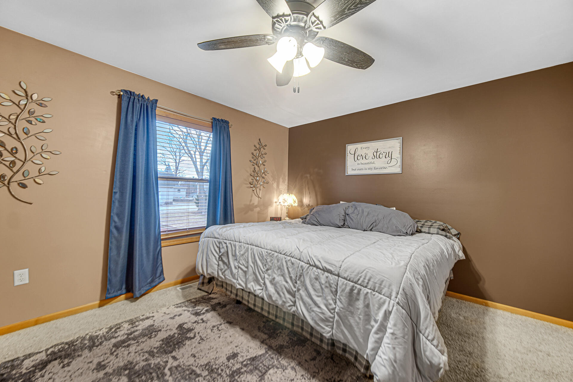 505 North Washington Street Hebron, IN 46341 - Photo 16 of 27 a bedroom with a bed and a chandelier