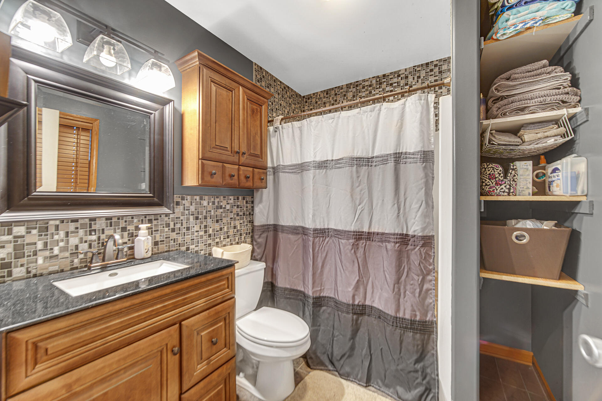 505 North Washington Street Hebron, IN 46341 - Photo 17 of 27 a bathroom with a sink toilet and shower