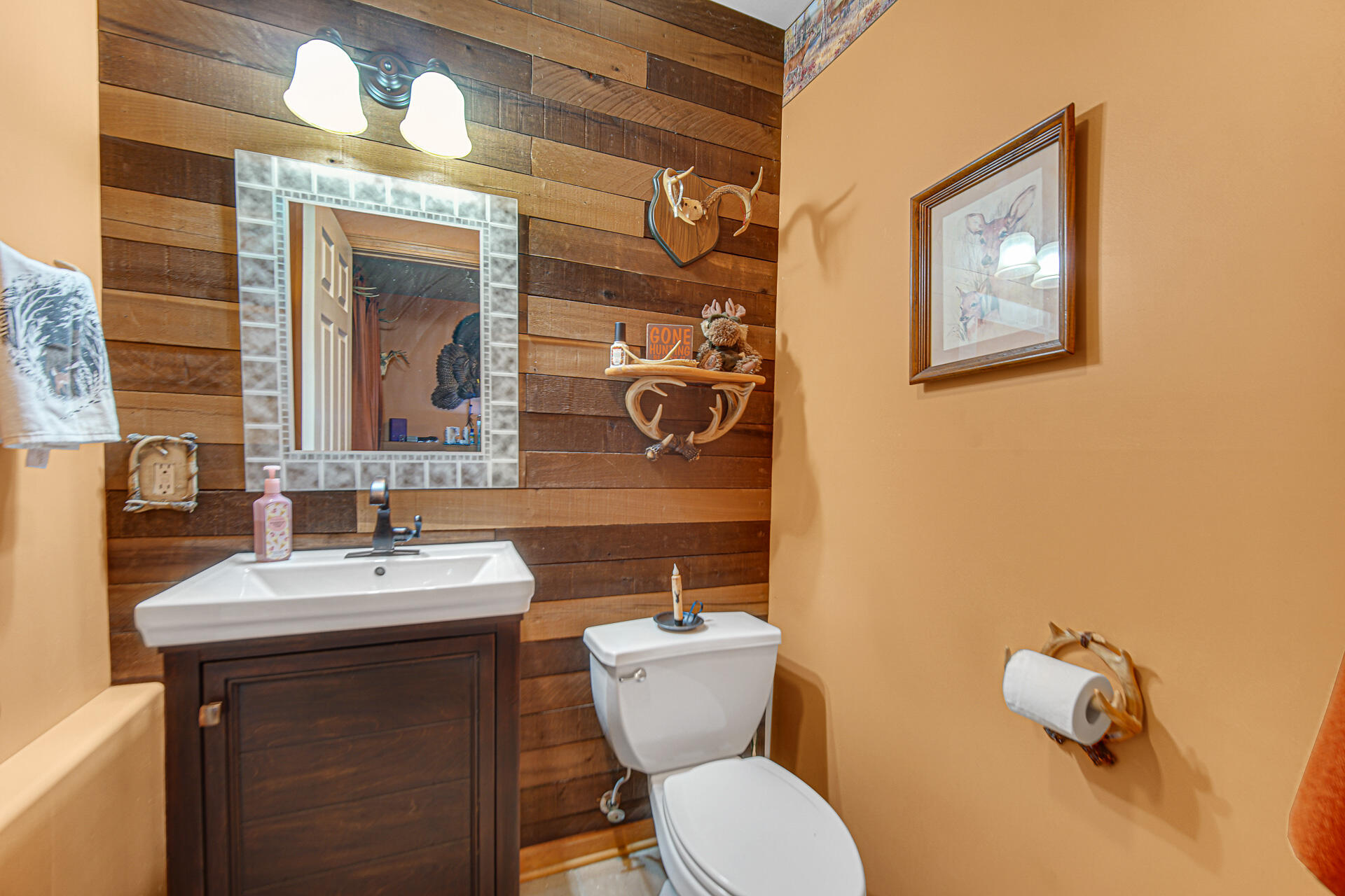 505 North Washington Street Hebron, IN 46341 - Photo 21 of 27 a bathroom with a toilet sink and mirror