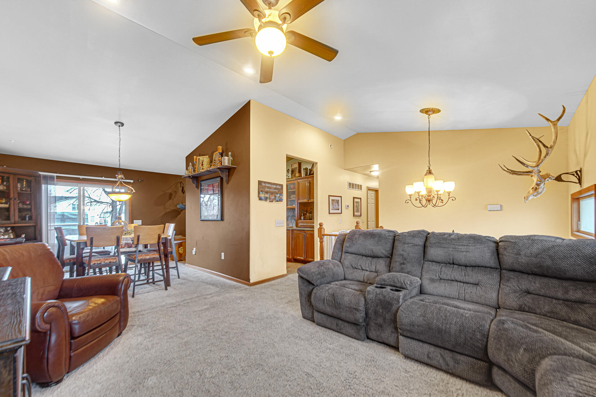 505 North Washington Street Hebron, IN 46341 - Photo 7 of 27 a living room with furniture a dining table and a chandelier