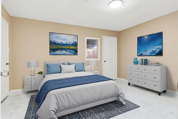 a bedroom with a bed and a dresser