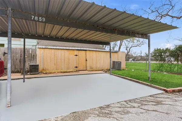 a view of a backyard with wooden floor and roof