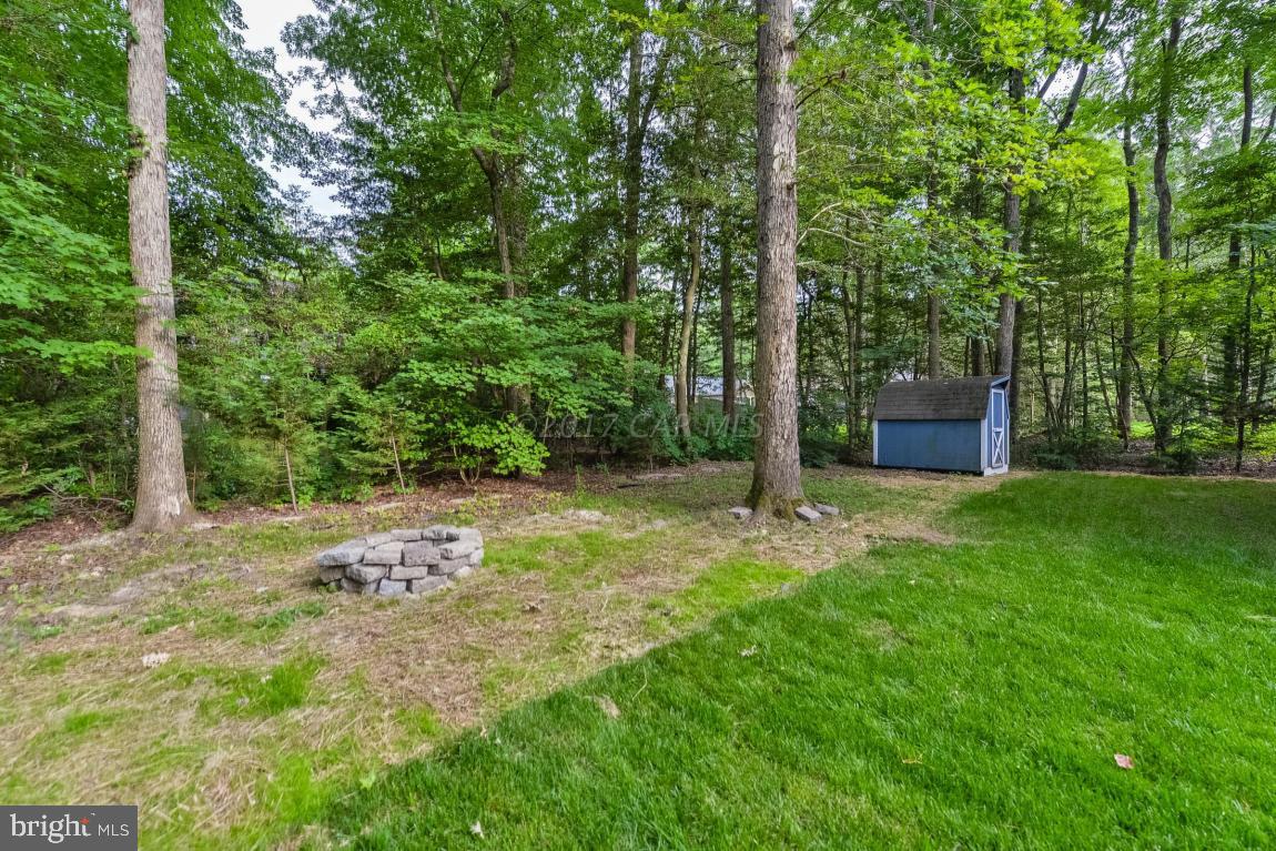 173 Sandyhook Road Ocean Pines, MD 21811 - Photo 12 of 40 a backyard of a house with lots of green space