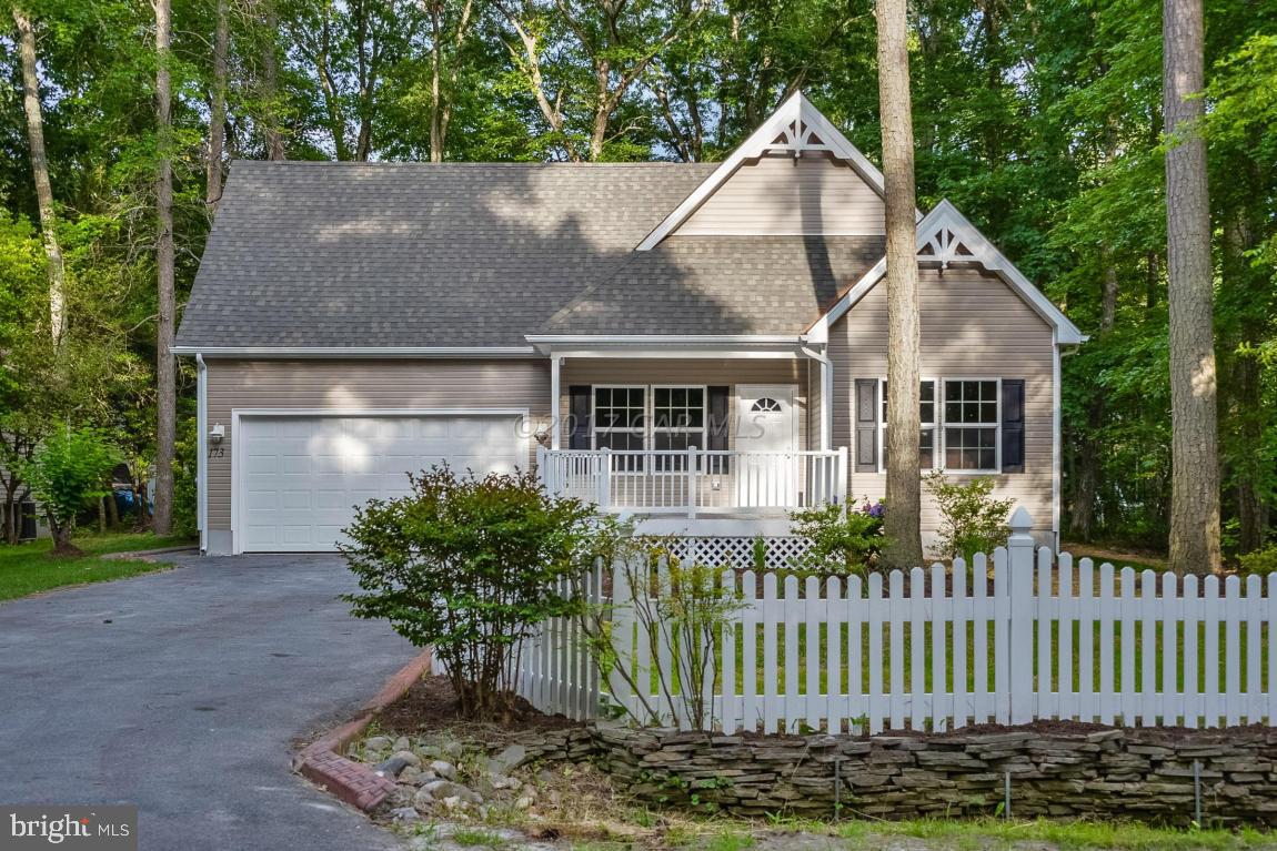 173 Sandyhook Road Ocean Pines, MD 21811 - Photo 14 of 40 a front view of a house with garden
