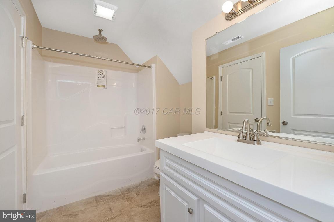 173 Sandyhook Road Ocean Pines, MD 21811 - Photo 15 of 40 a bathroom with a bathtub and a sink