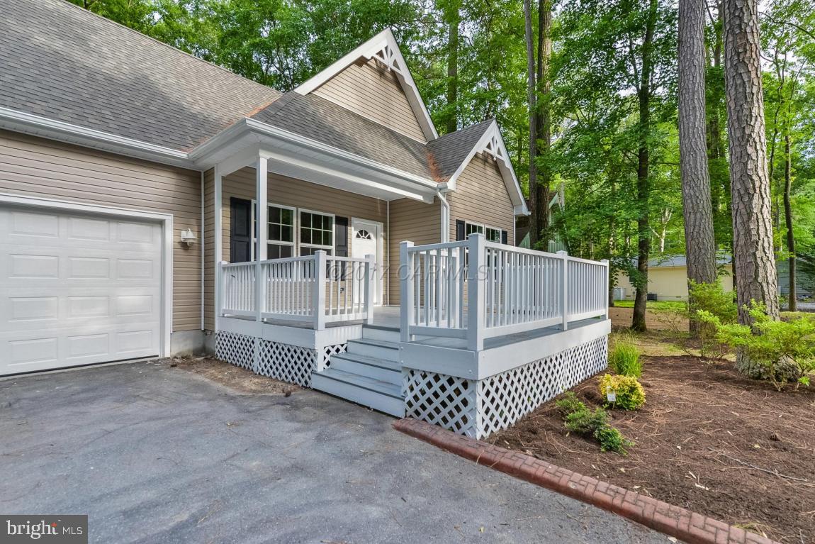 173 Sandyhook Road Ocean Pines, MD 21811 - Photo 18 of 40 a view of a house with backyard and garden