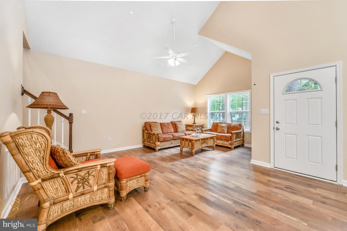 173 Sandyhook Road Ocean Pines, MD 21811 - Photo 20 of 40 a living room with furniture and a wooden floor