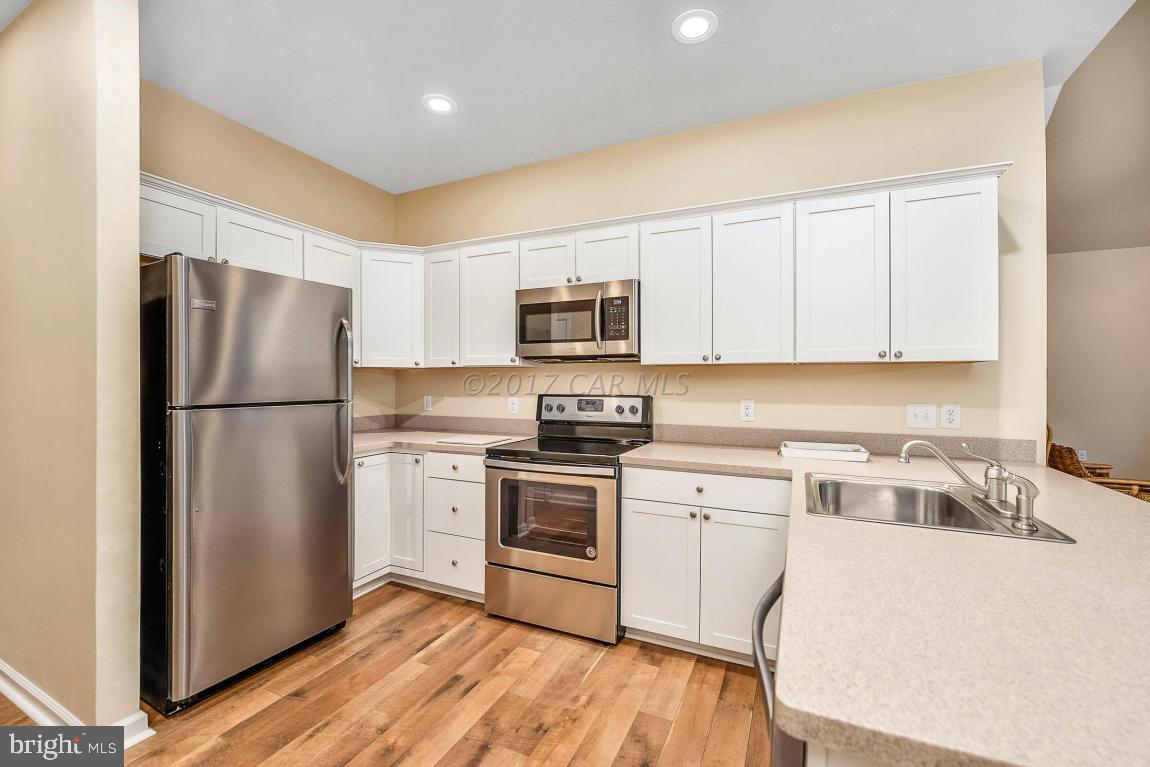 173 Sandyhook Road Ocean Pines, MD 21811 - Photo 3 of 40 a kitchen with a refrigerator sink and microwave