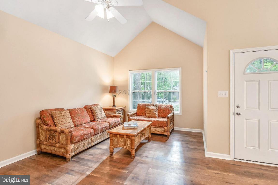 173 Sandyhook Road Ocean Pines, MD 21811 - Photo 22 of 40 a living room with furniture and a large window