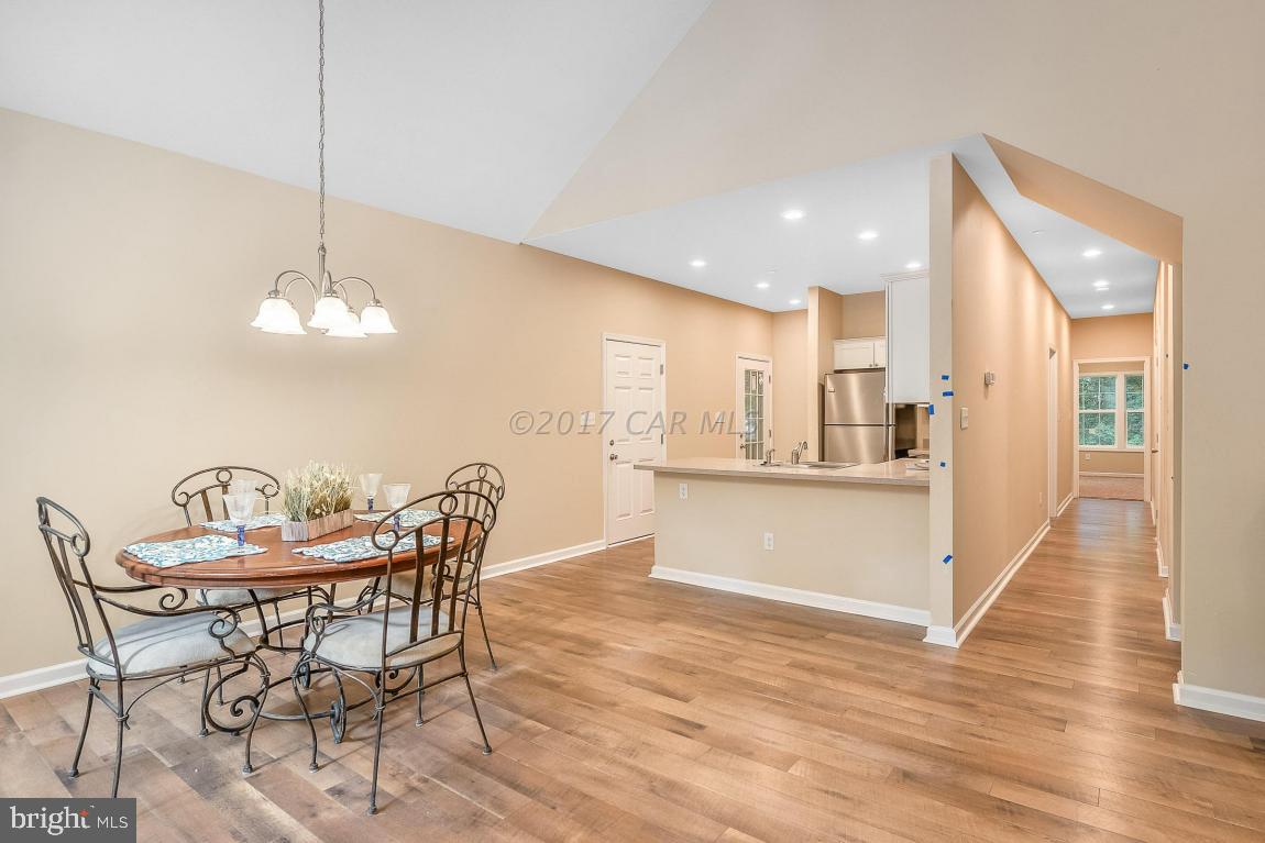173 Sandyhook Road Ocean Pines, MD 21811 - Photo 25 of 40 a view of a dining room with furniture and wooden floor