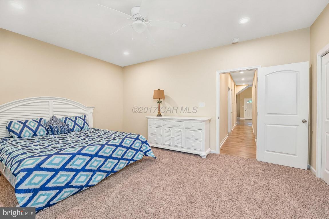 173 Sandyhook Road Ocean Pines, MD 21811 - Photo 28 of 40 a bedroom with a bed and a cabinets