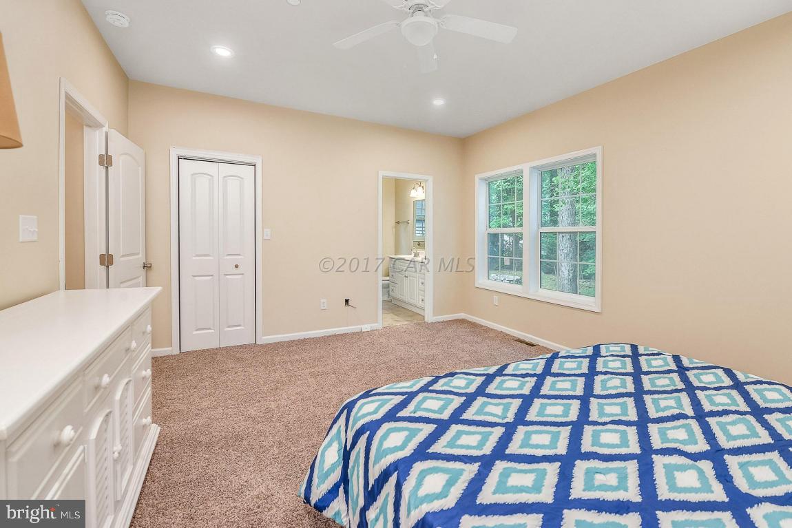173 Sandyhook Road Ocean Pines, MD 21811 - Photo 29 of 40 a bedroom with a bed and a window