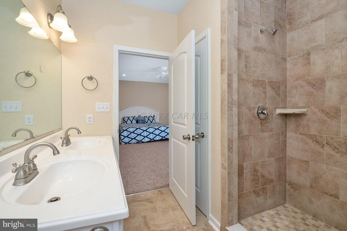 173 Sandyhook Road Ocean Pines, MD 21811 - Photo 30 of 40 a bathroom with a sink a toilet and shower