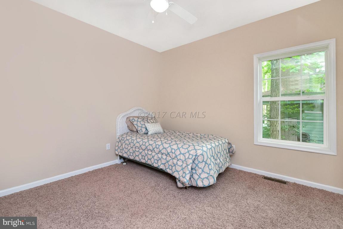 173 Sandyhook Road Ocean Pines, MD 21811 - Photo 31 of 40 a room with a bed and a window