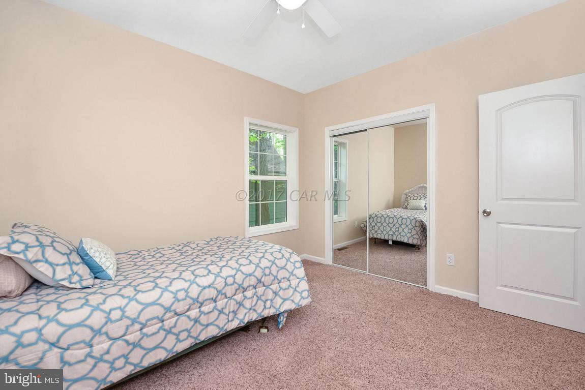 173 Sandyhook Road Ocean Pines, MD 21811 - Photo 32 of 40 a bedroom with a bed and a window