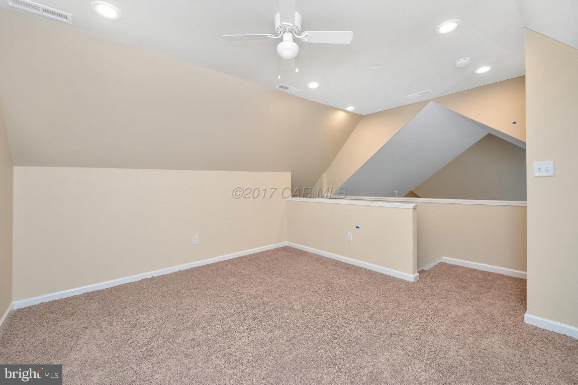 173 Sandyhook Road Ocean Pines, MD 21811 - Photo 33 of 40 wooden floor in an empty room with a ceiling fan