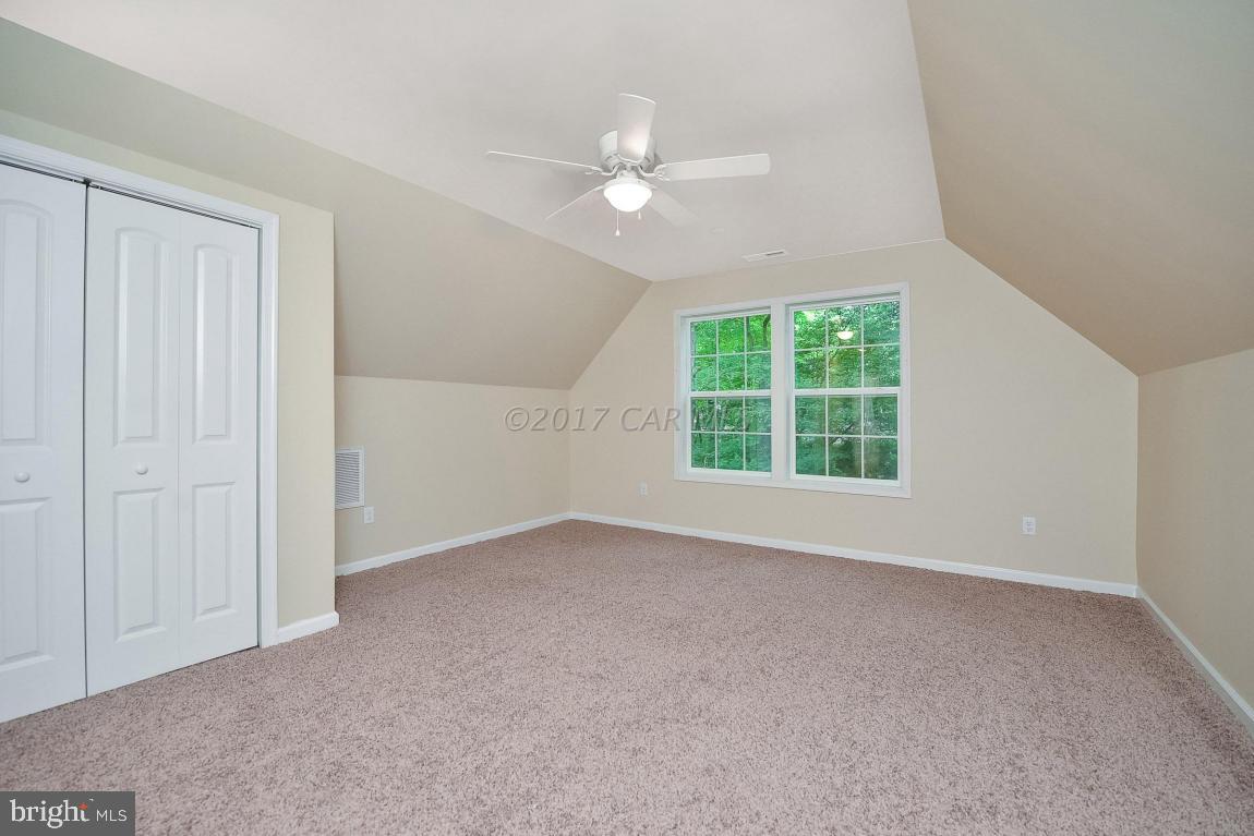 173 Sandyhook Road Ocean Pines, MD 21811 - Photo 36 of 40 an empty room with windows and fan