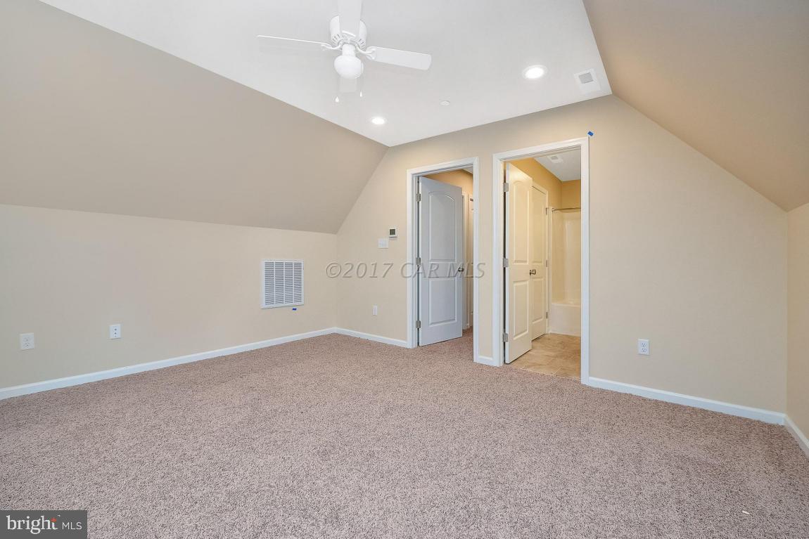 173 Sandyhook Road Ocean Pines, MD 21811 - Photo 37 of 40 an empty room with fan and entrance