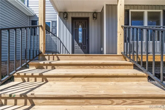a view of an entryway door with wooden floor