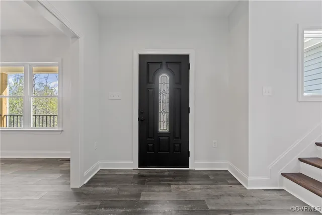 a view of a hallway with the wooden floor