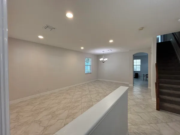 a view of an empty room with a window