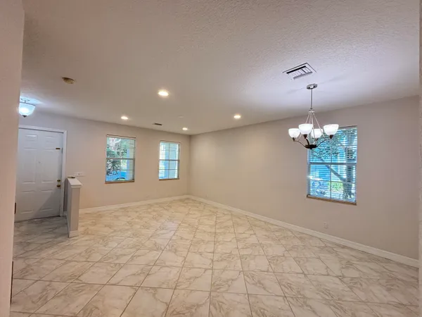 a kitchen with stainless steel appliances granite countertop a stove a sink dishwasher and a microwave oven on the blue kitchen countertops