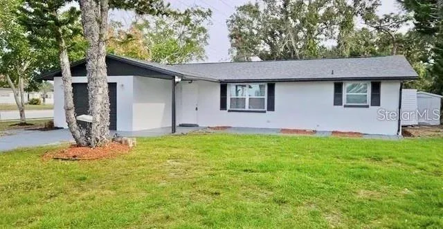a front view of house with yard and seating space