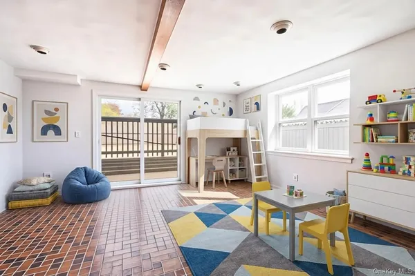 a living room with furniture a window and a table