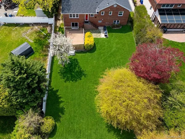 an aerial view of a house with pool yard outdoor seating and yard