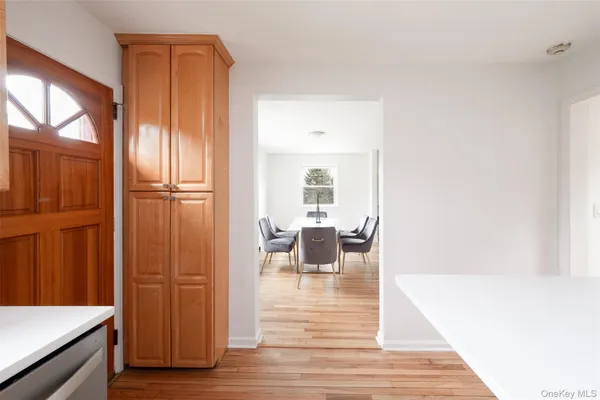 a view of kitchen with furniture and wooden floor