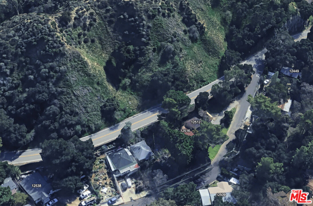 12500 Kagel Canyon Road Sylmar, CA 91342 - Photo 8 of 8 a view of a house with a yard and covered with trees