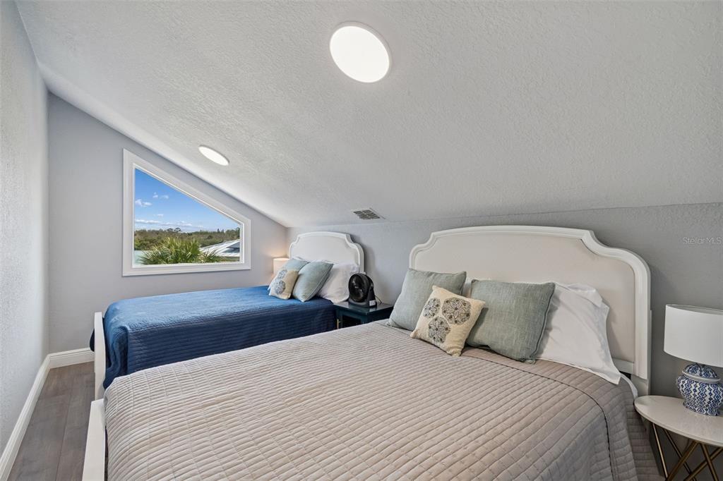 330 6th Avenue Indian Rocks Beach, FL 33785 - Photo 31 of 52 a bedroom with a bed and window