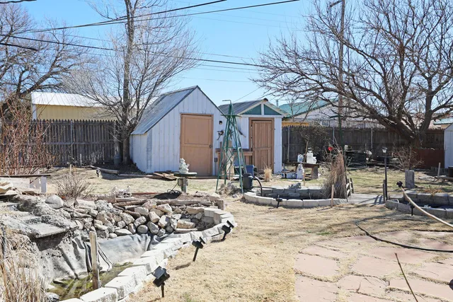 a view of a building with snow on the road