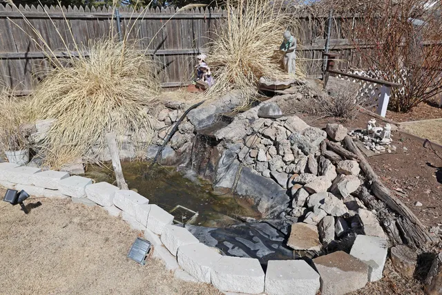 a view of swimming pool with a yard