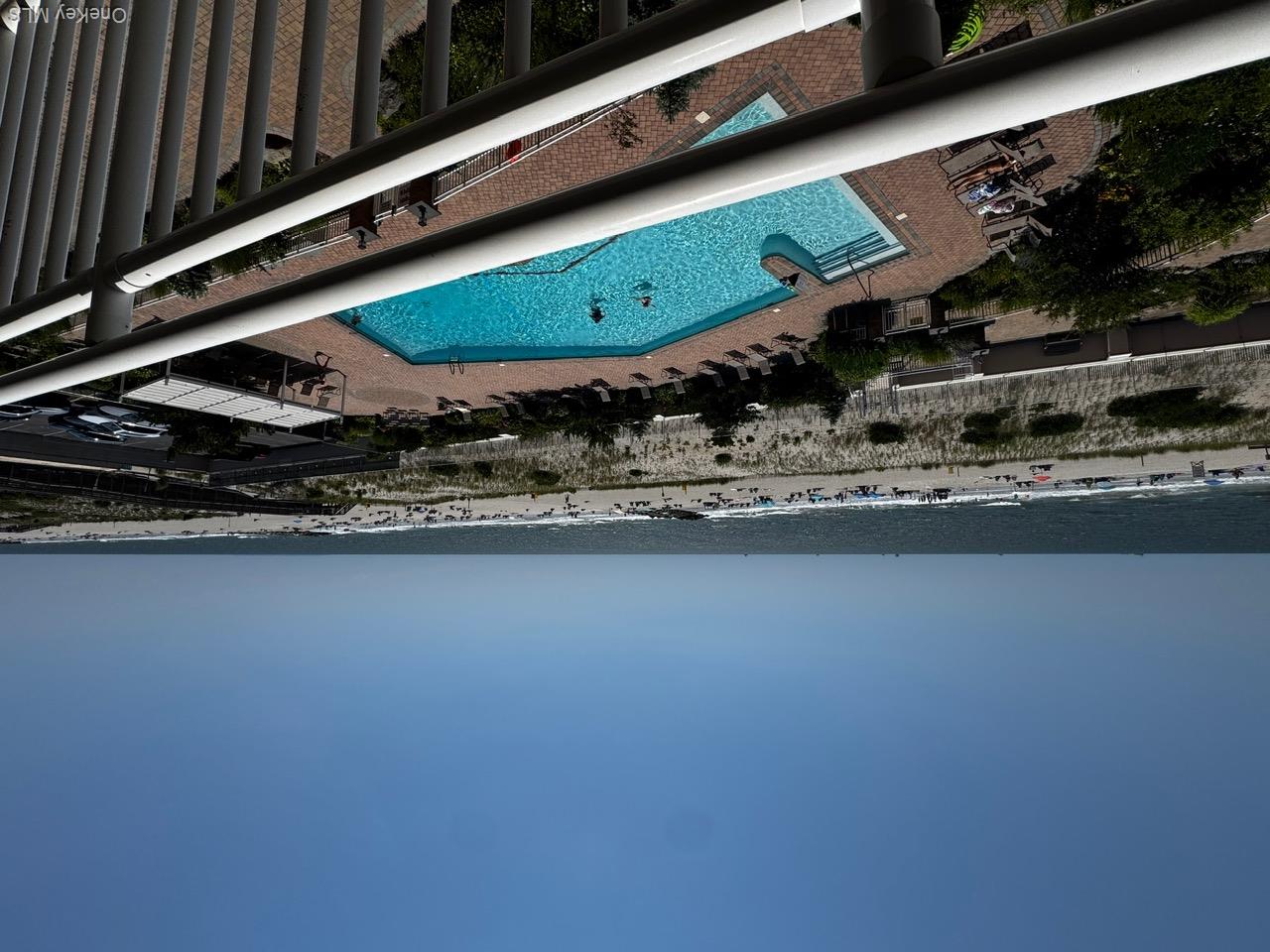 830 Shore Road, Unit 4M Long Beach, NY 11561 - Photo 2 of 20 Community pool featuring view of water and beach