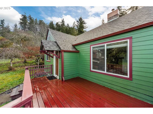 a view of outdoor space and yard from deck