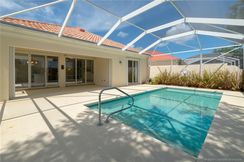 1313 Southwest Balmoral Trace Stuart, FL 34997 - Photo 49 of 70 Newly screened pool enclosure and nice amount of covered patio