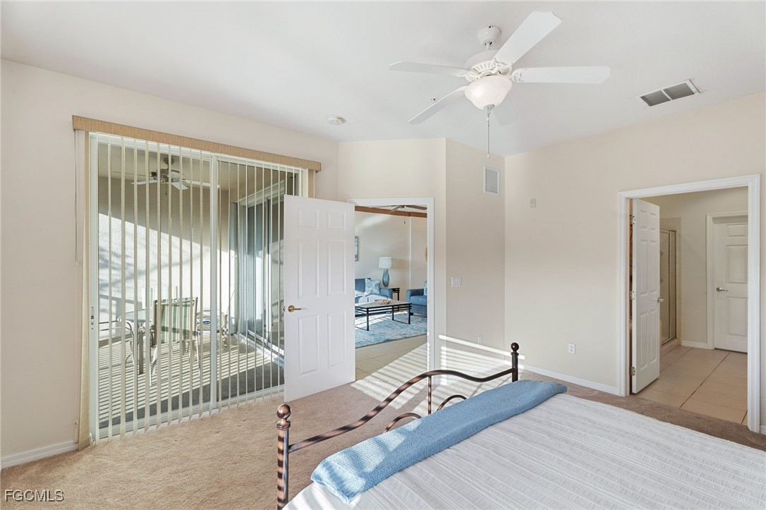 14981 Reflection Key Circle, Unit 335 Fort Myers, FL 33907 - Photo 23 of 42 a bed room with a bed and a window