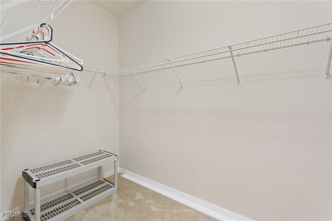 14981 Reflection Key Circle, Unit 335 Fort Myers, FL 33907 - Photo 27 of 42 a view of a room with racks on the wall