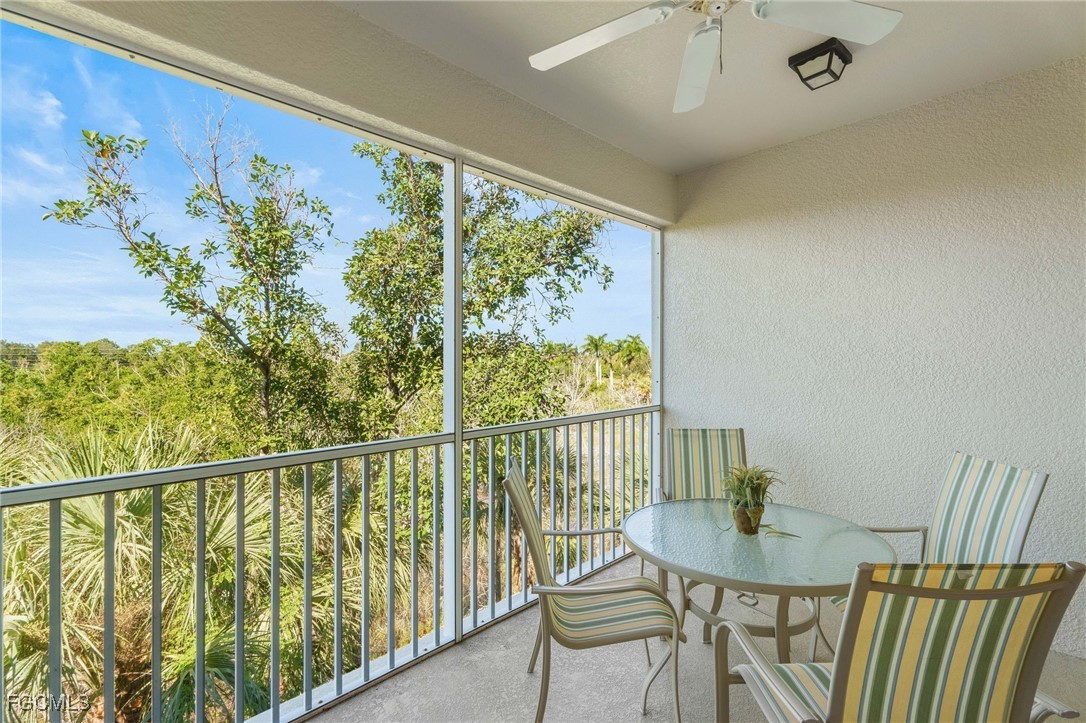 14981 Reflection Key Circle, Unit 335 Fort Myers, FL 33907 - Photo 29 of 42 a view of a chairs and table in the balcony