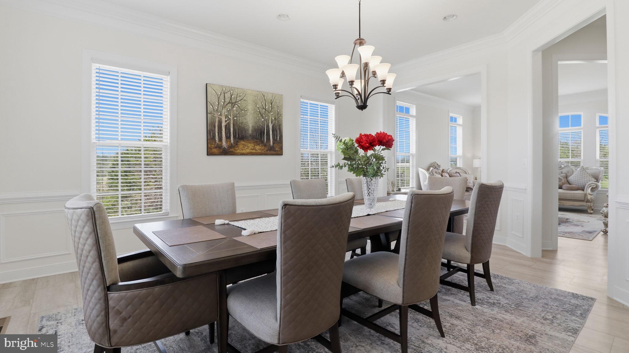 11502 Aden Road Nokesville, VA 20181 - Photo 28 of 106 a view of a dining room with furniture a chandelier and wooden floor