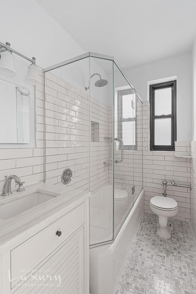 Undisclosed Address Manhattan, NY 10021 - Photo 10 of 15 a bathroom with a sink a toilet and shower