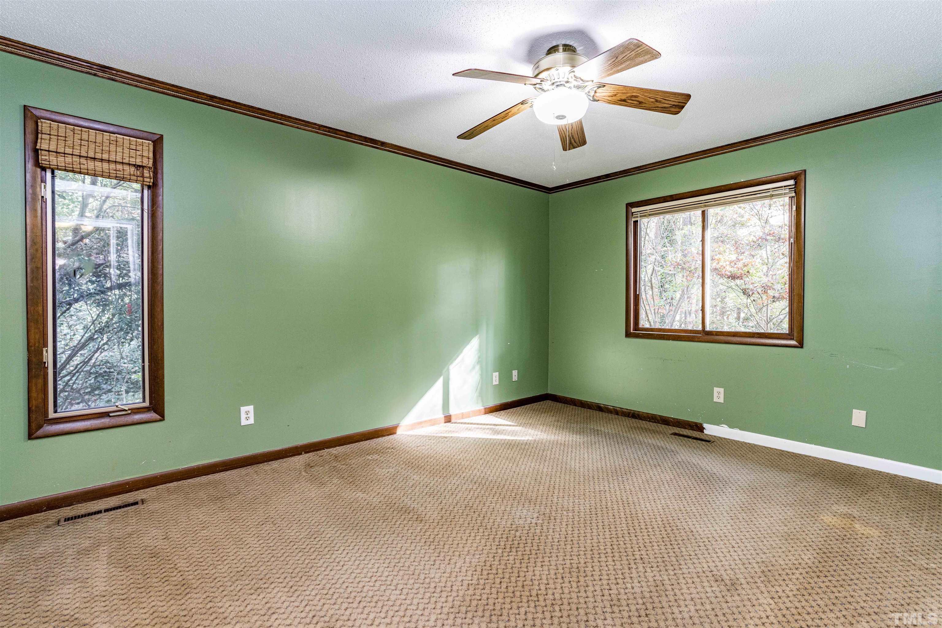 3105 Rutledge Court Raleigh, NC 27613 - Photo 24 of 48 a view of a room with a fan and a window