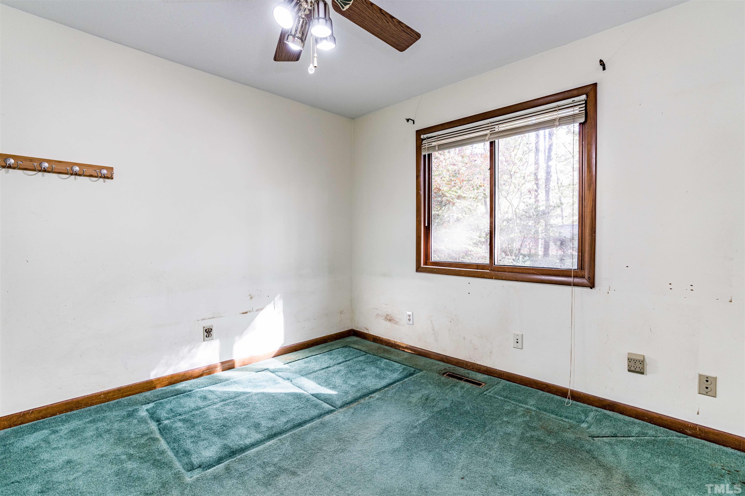 3105 Rutledge Court Raleigh, NC 27613 - Photo 26 of 48 wooden floor in an empty room with a window