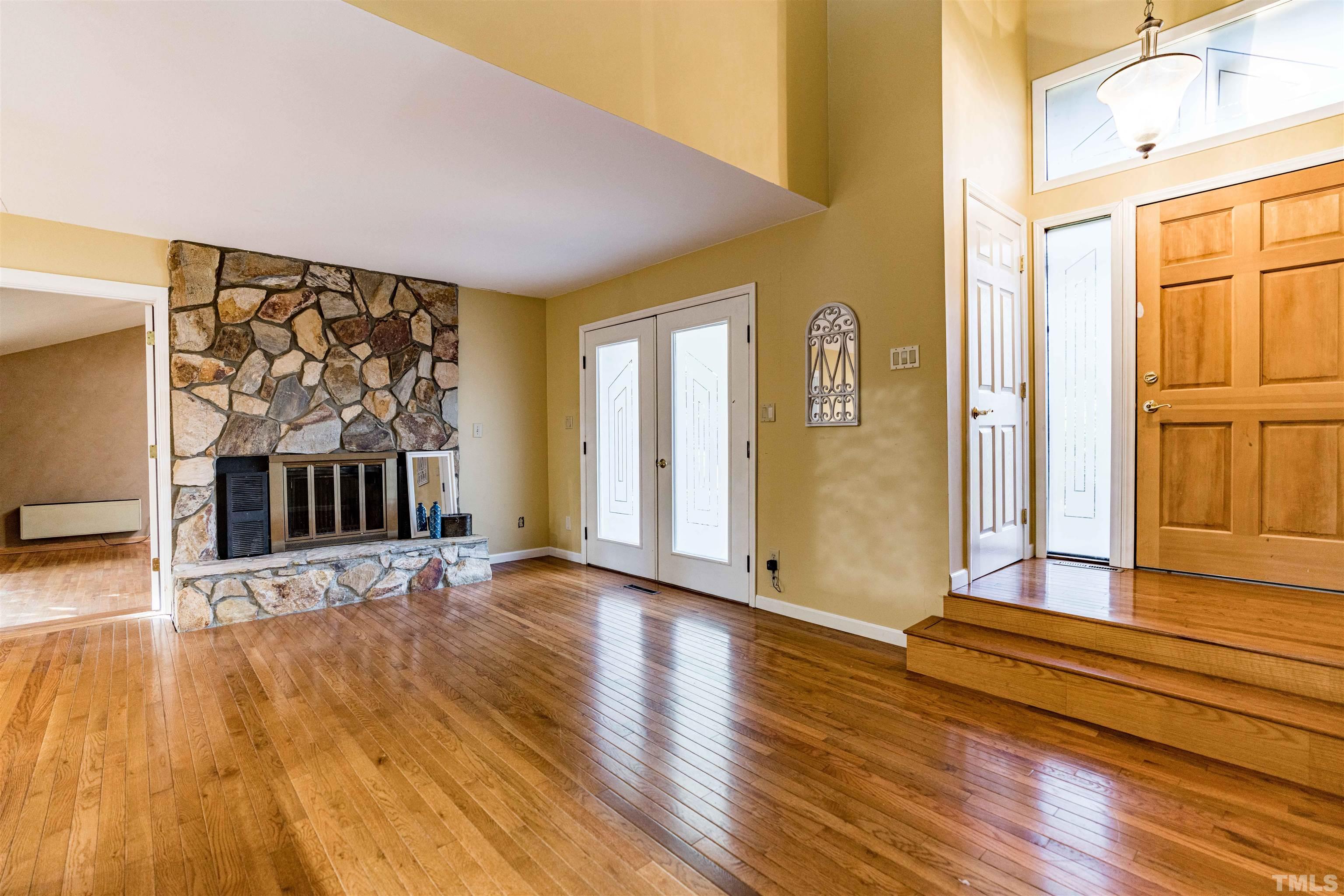 3105 Rutledge Court Raleigh, NC 27613 - Photo 3 of 48 a view of front door with wooden floor and a window