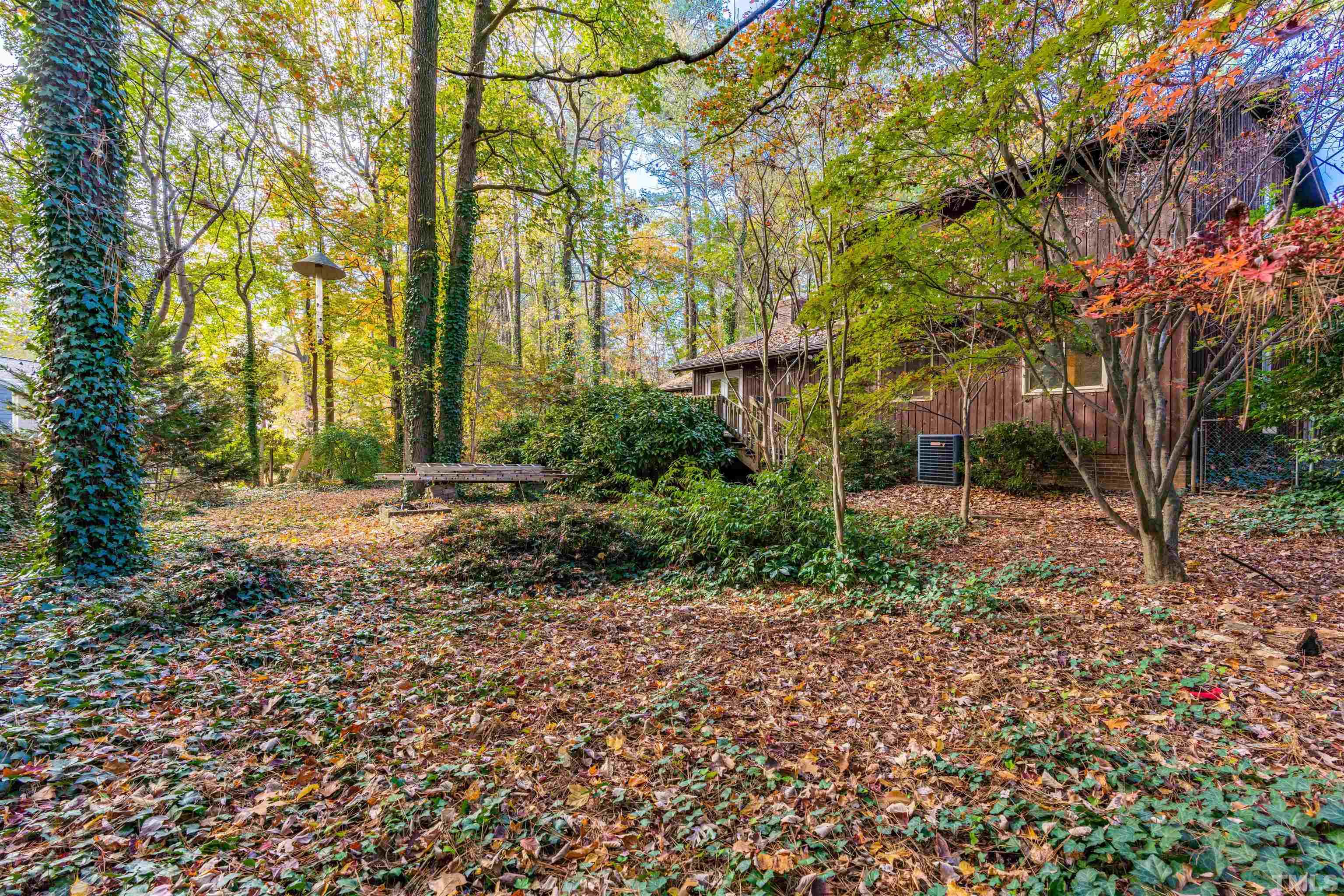 3105 Rutledge Court Raleigh, NC 27613 - Photo 36 of 48 a backyard of a house with lots of green space