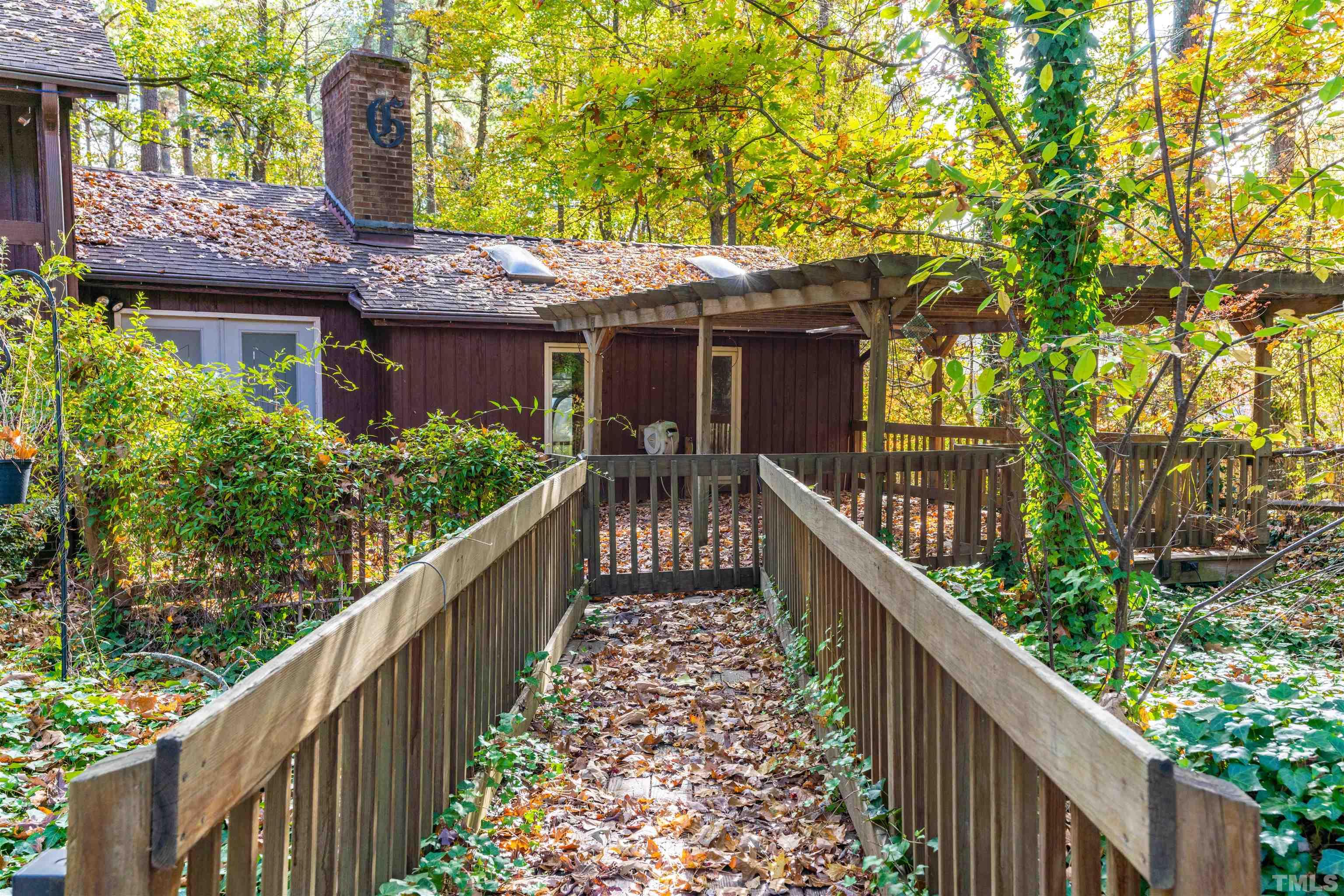 3105 Rutledge Court Raleigh, NC 27613 - Photo 44 of 48 a view of a house with wooden fence