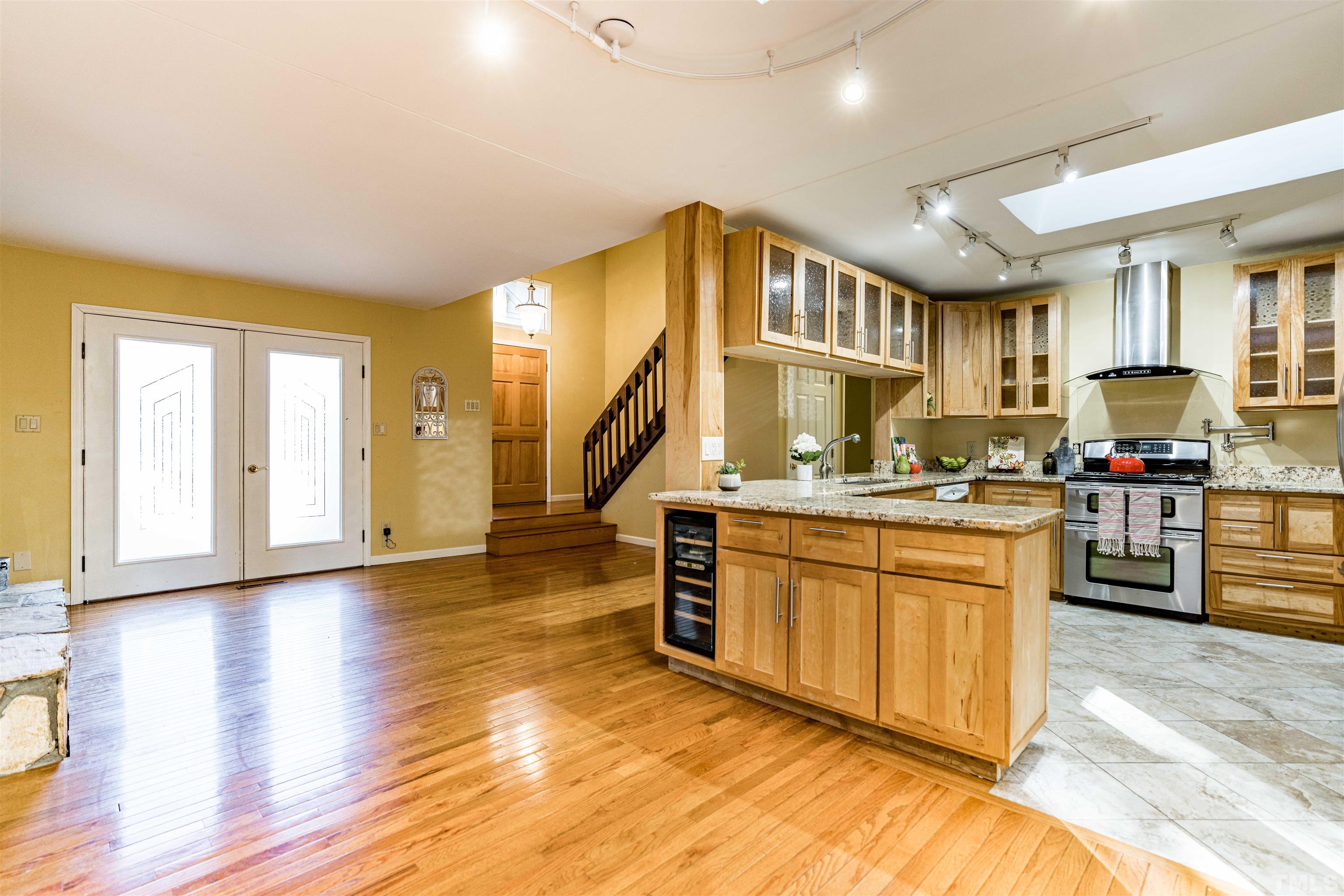 3105 Rutledge Court Raleigh, NC 27613 - Photo 5 of 48 a kitchen with stainless steel appliances granite countertop a stove and a sink