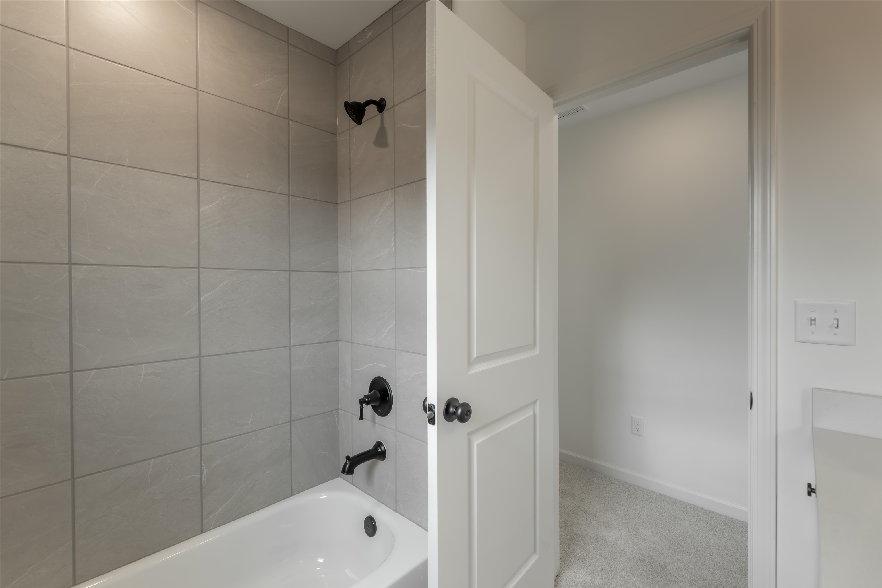 22 Doral Loop Oakland, TN 38060 - Photo 19 of 27 a bathroom with a bathtub and shower